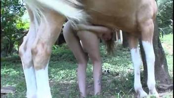 Busty dark-haired woman with a curvy butt attempts to have sex with a pony