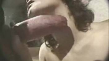 Wavy-haired brunette pleasures huge dick of ebony guy in doggy style