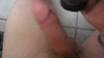 Guy strokes his erection while his dog licks it from a first-person view
