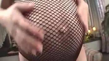 Japanese babe in a fishnet bodysuit gets fucked by a dog