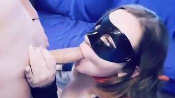 Masked chick sucks on a dog's dick and one more peen