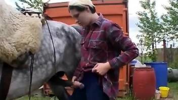 Short-haired lady blows a very hot stallion on camera