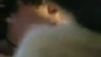 Alluring dark-haired vixen performing deep oral on a canine's shaft