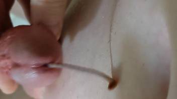 Naked man inserts worm into his dick for spicy solo zoophilia