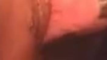 Dark-haired woman inserts a stallion's penis into her eager mouth