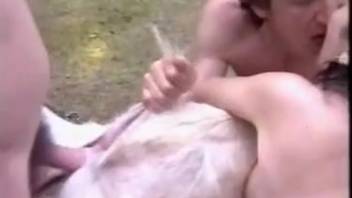 Excited woman passed around by two lustful men and the canine