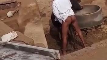 Naked ebony man recorded while butt-fucking a cow in outdoor footage