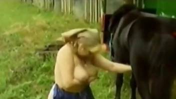 Big boobs blonde lady worships horse cock outdoors