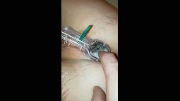 Slender woman stuffs numerous bugs into her damp pussy