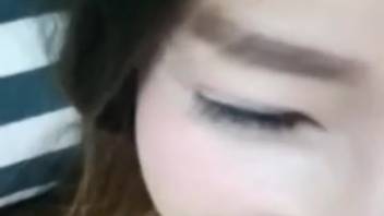 Petite Asian vixen captured on camera experimenting with bestiality for her first attempt