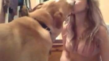 Blonde lady in a hat making out with her sexy beast