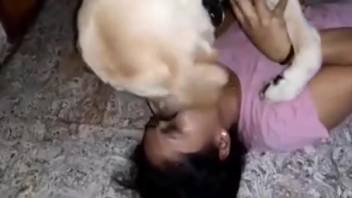 Stunning dark-haired woman enjoying time with a white pup