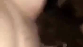 Dark-haired woman stroking her vagina while having sex with her animal