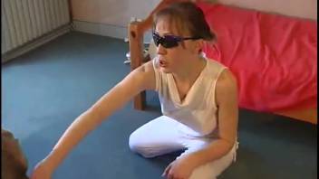 Sexy woman in sunglasses penetrated by a dog from behind