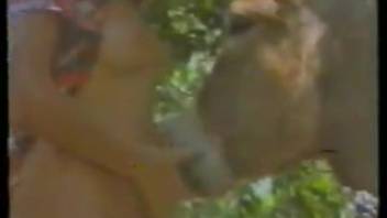 Lady performs oral sex on the horse's penis in promiscuous scenes and then has intercourse with it